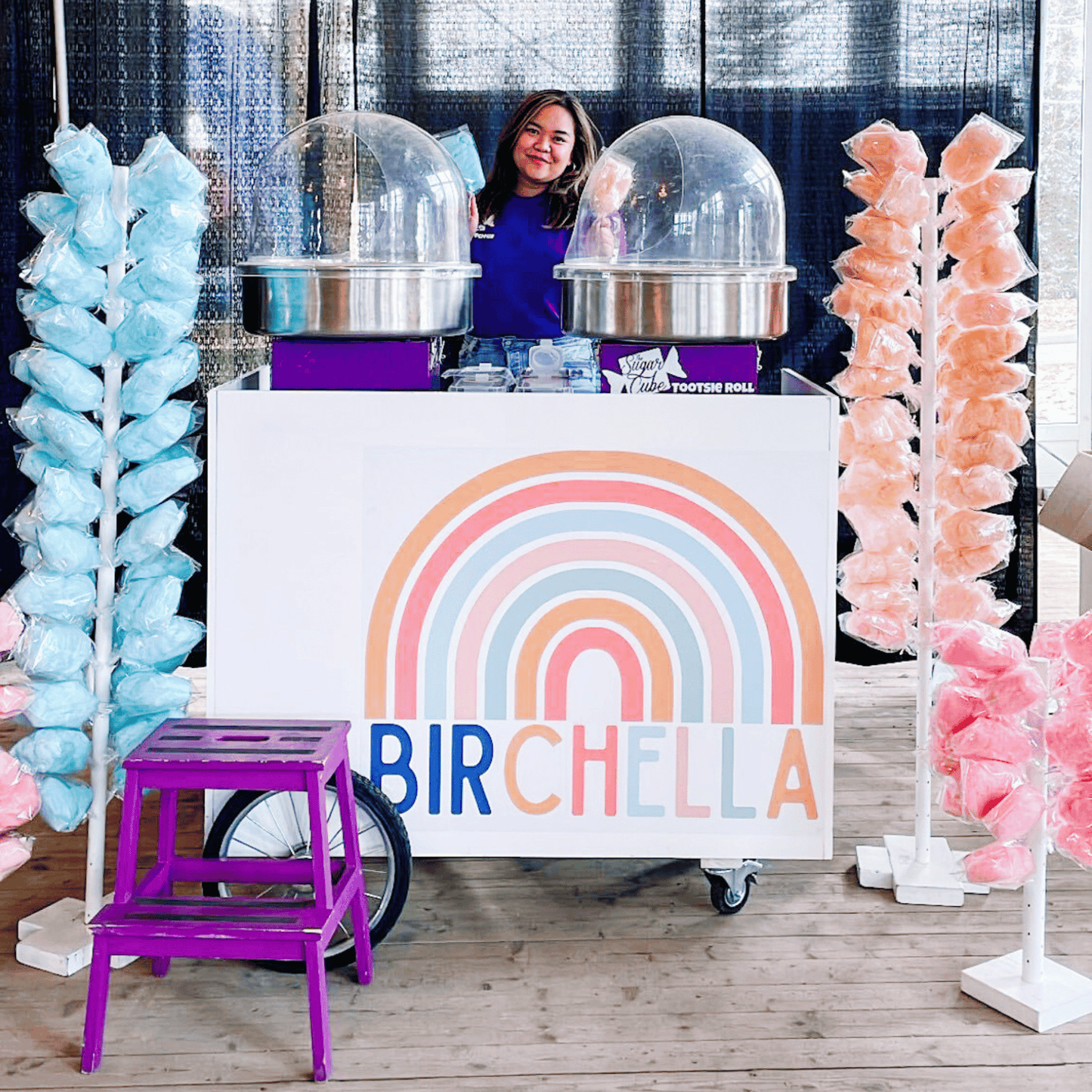 The Sugar Cube Cotton Candy Cart set up with fresh blue and pink cotton candy for an event in Calgary.