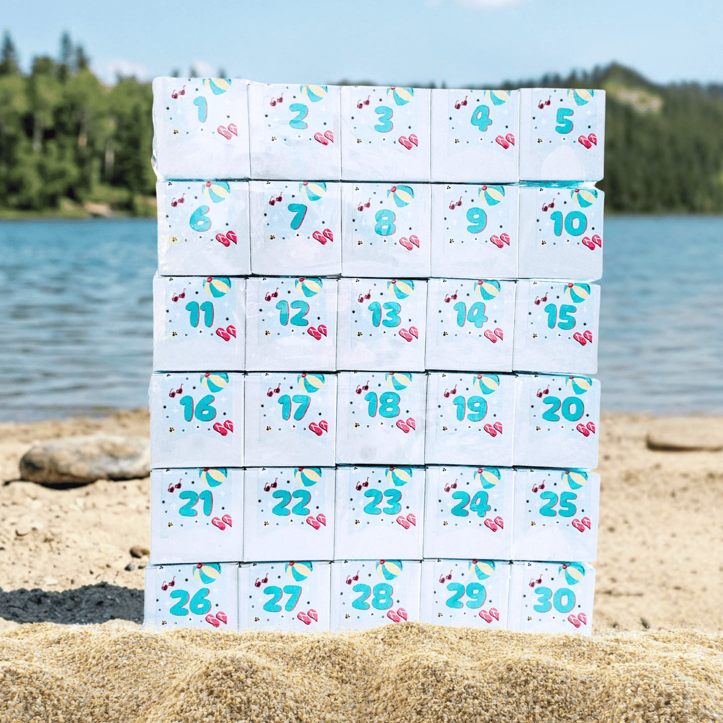Custom 30-day summer candy countdown calendar for Beam Orthodontics adapted from The Sugar Cube's Advent Calendar displayed on a beach, featuring branded artwork.
