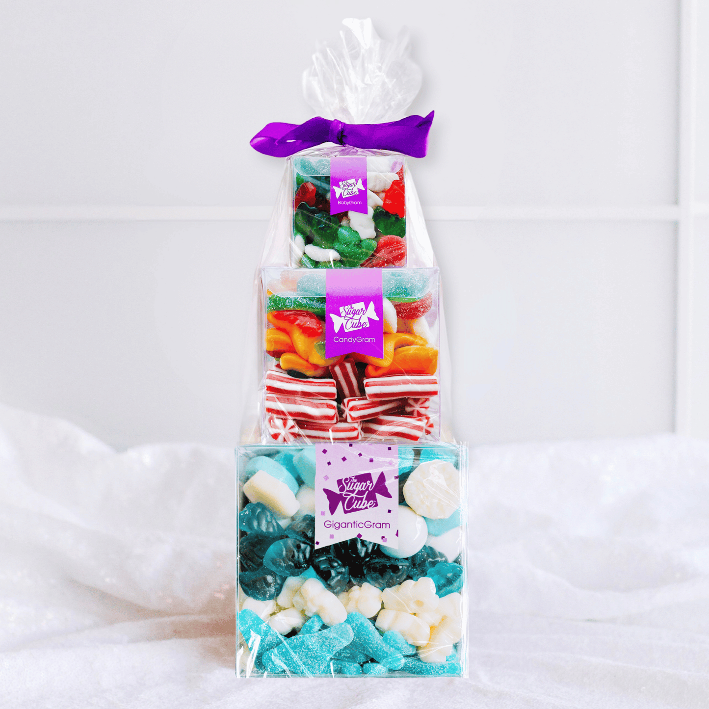 Stacked Christmas CandyGram featuring three candy-filled cubes tied together for a festive and showstopping holiday gift