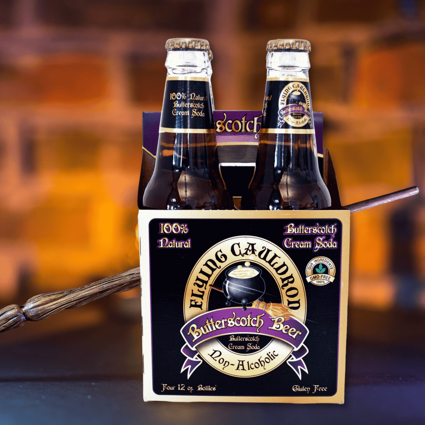 Four-pack of Butterbeer butterscotch cream soda displayed with a wand