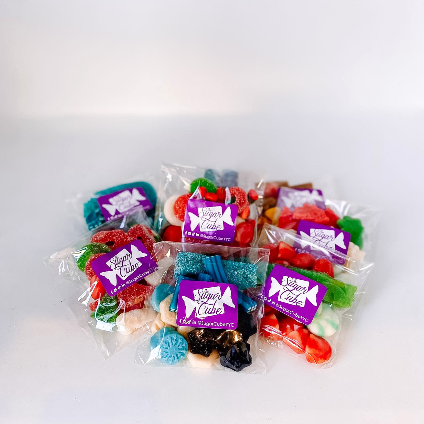 Assorted Christmas candy bags filled with festive sweets for stocking stuffers and holiday gifting