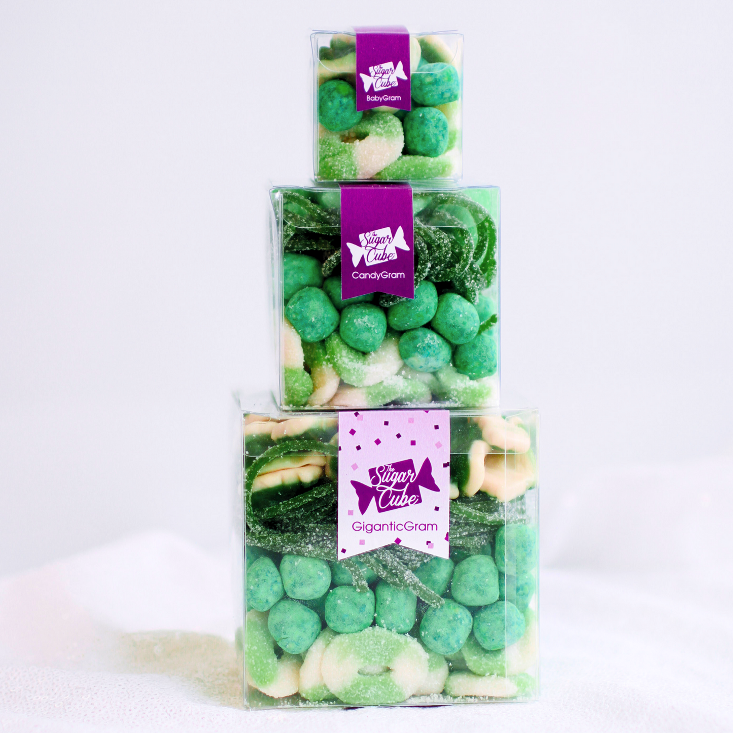 Festive holiday Stacked CandyGram with Baby, Regular and Gigantic candy-filled cubes ready for Christmas gifting