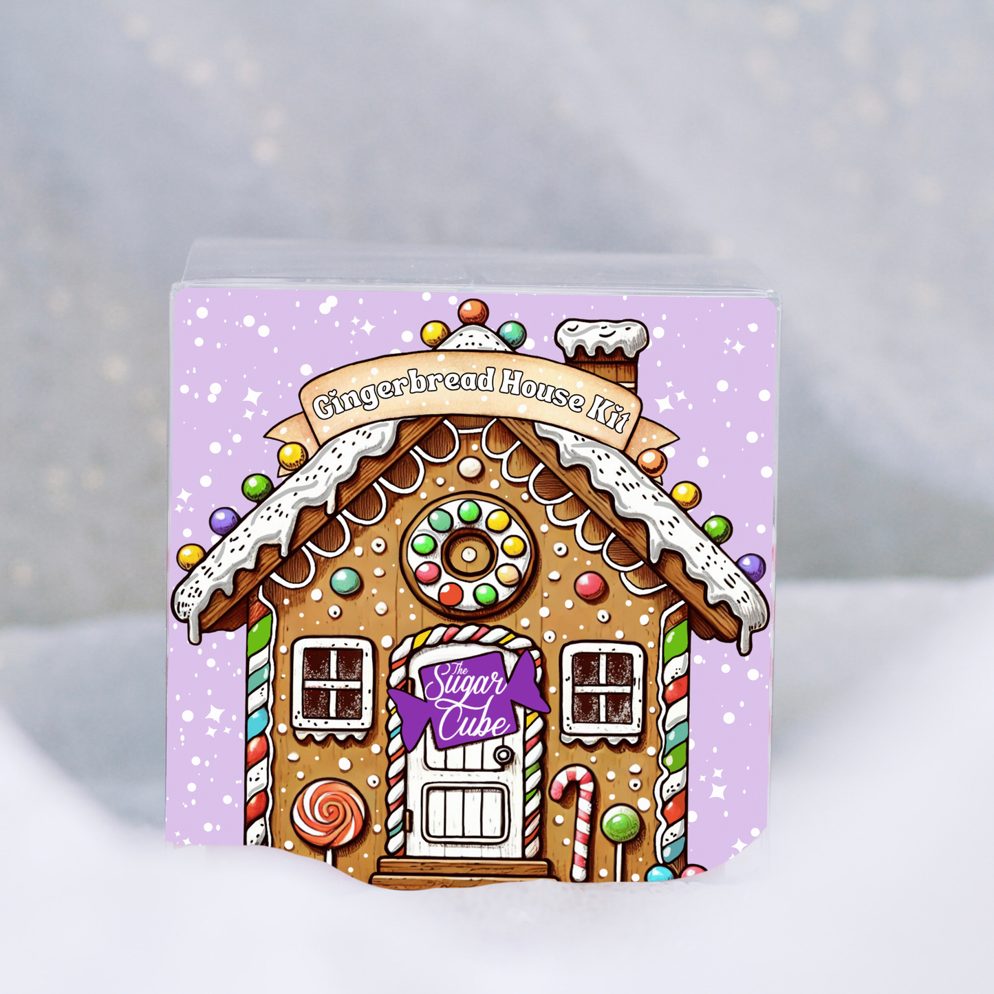Christmas gingerbread house kit front view showing the festive illustrated packaging and decorating kit