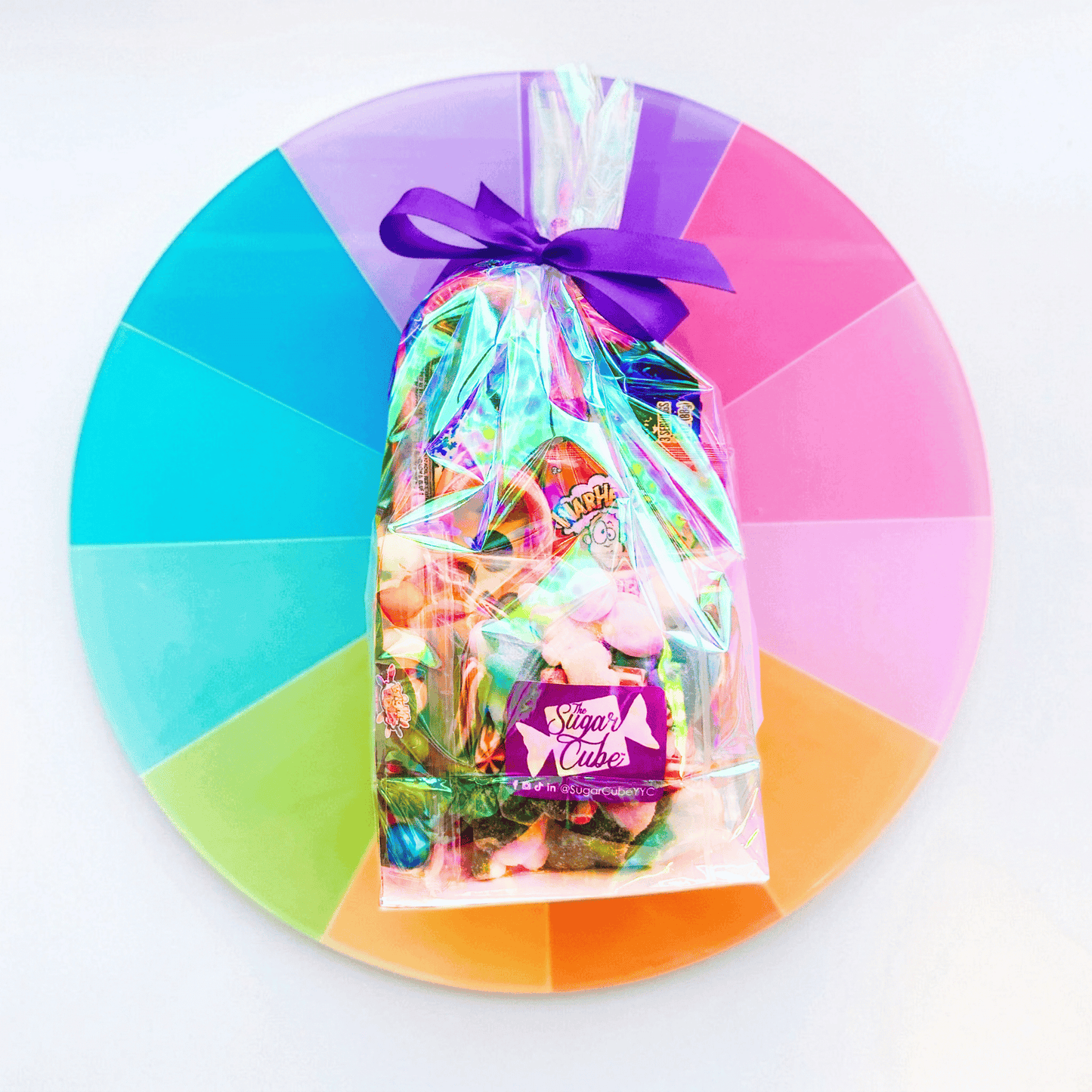Large Christmas stocking stuffer gift bag filled with assorted gummies, sweets and individually wrapped candy