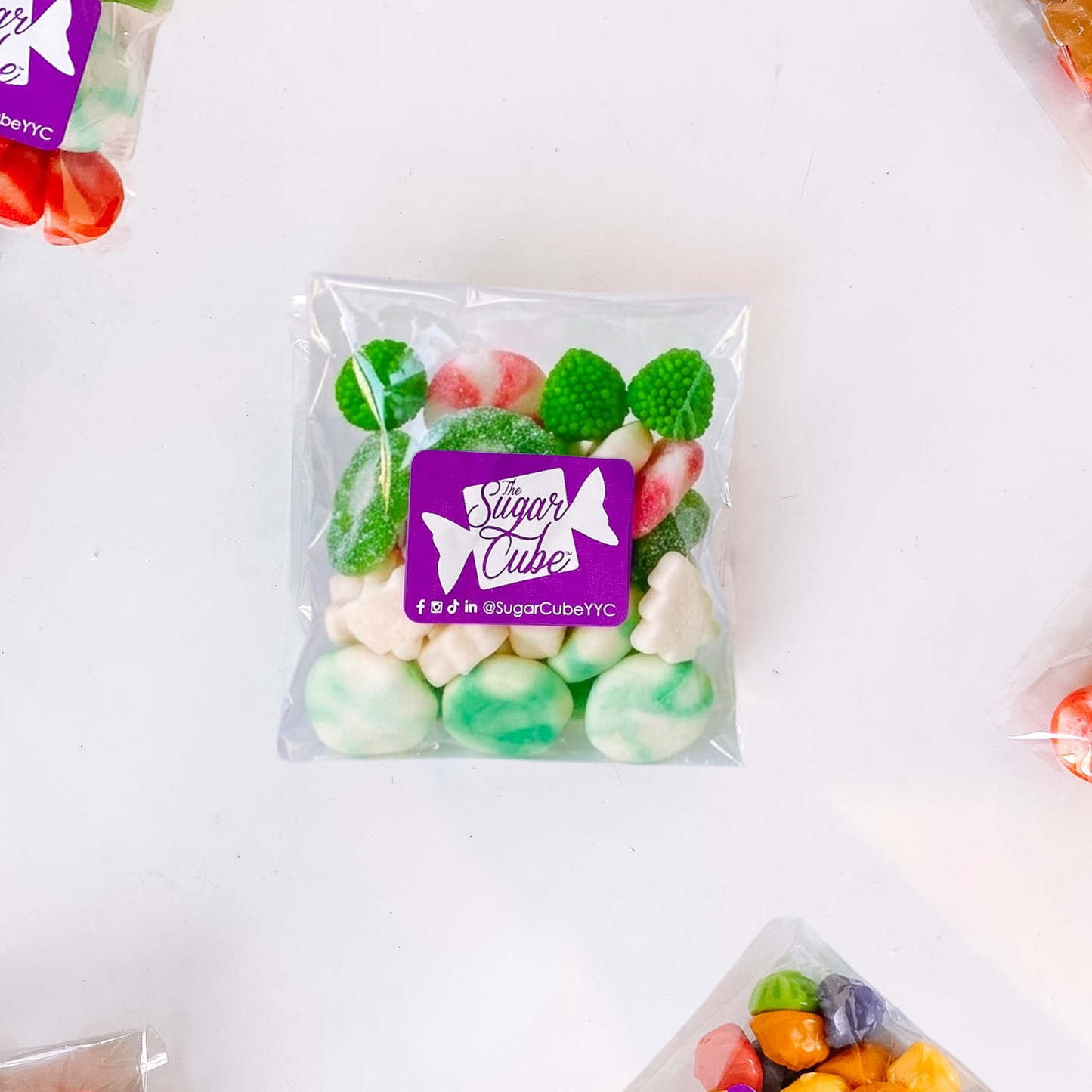 Merry and Bright holiday candy bag filled with colourful pink and green seasonal candy