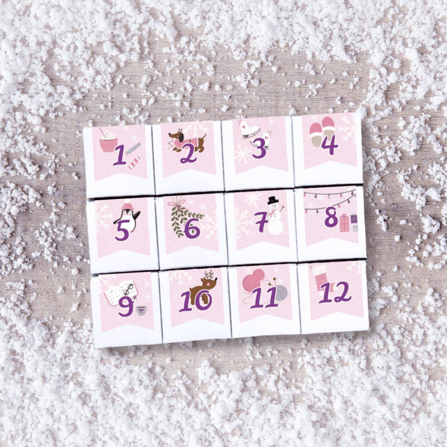 Mini 12-day candy Advent calendar from The Sugar Cube featuring 12 individually numbered boxes of assorted candy in a non-chocolate holiday countdown.