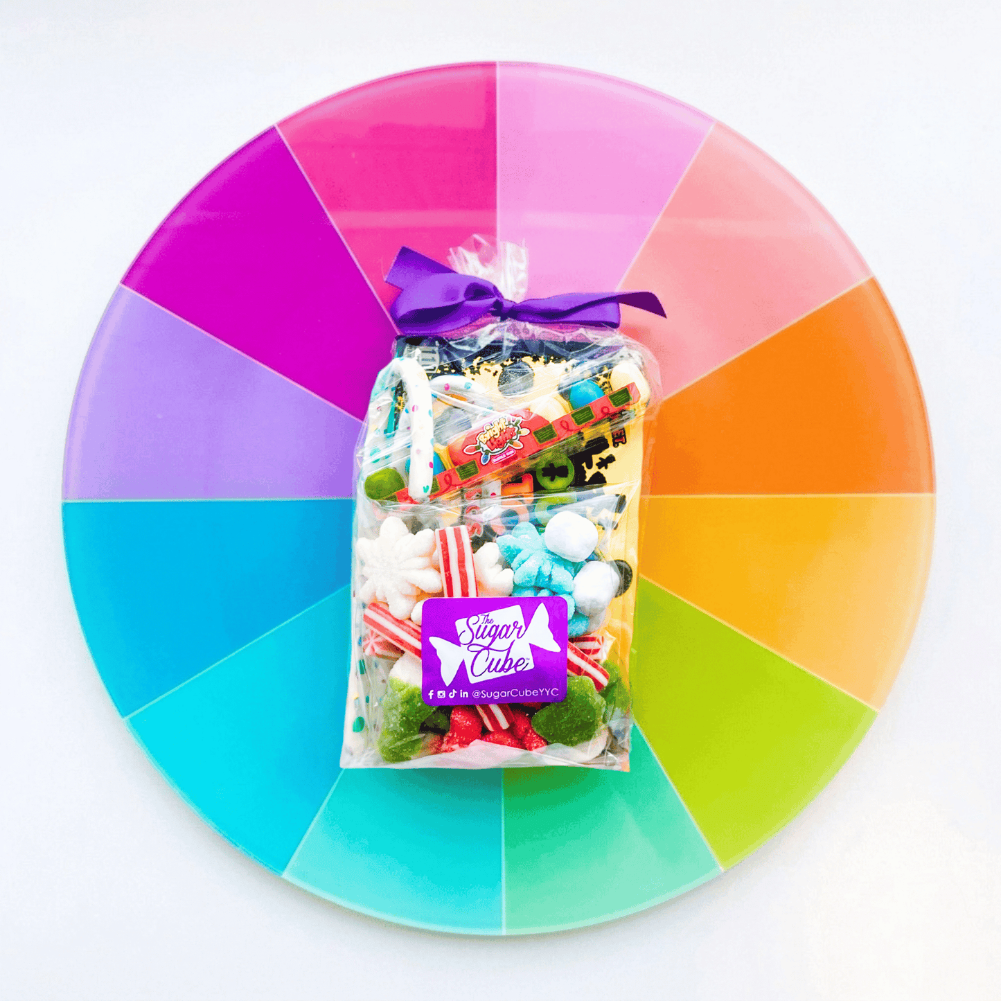 Regular Christmas stocking stuffer gift bag filled with festive red, green and white candy plus wrapped sweets