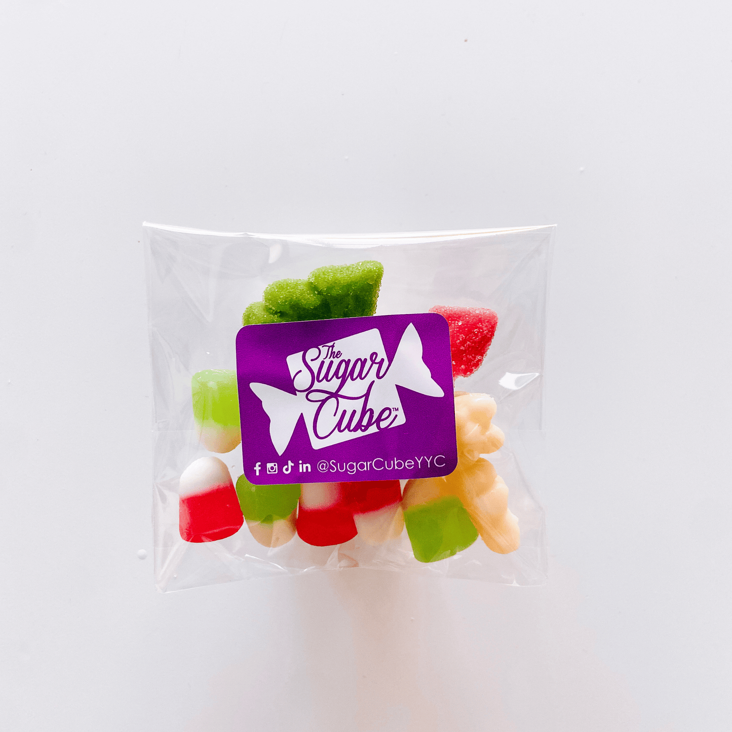 Spread the Cheer Christmas candy bag filled with a festive mix of red, green and white sweets, sours and gummies