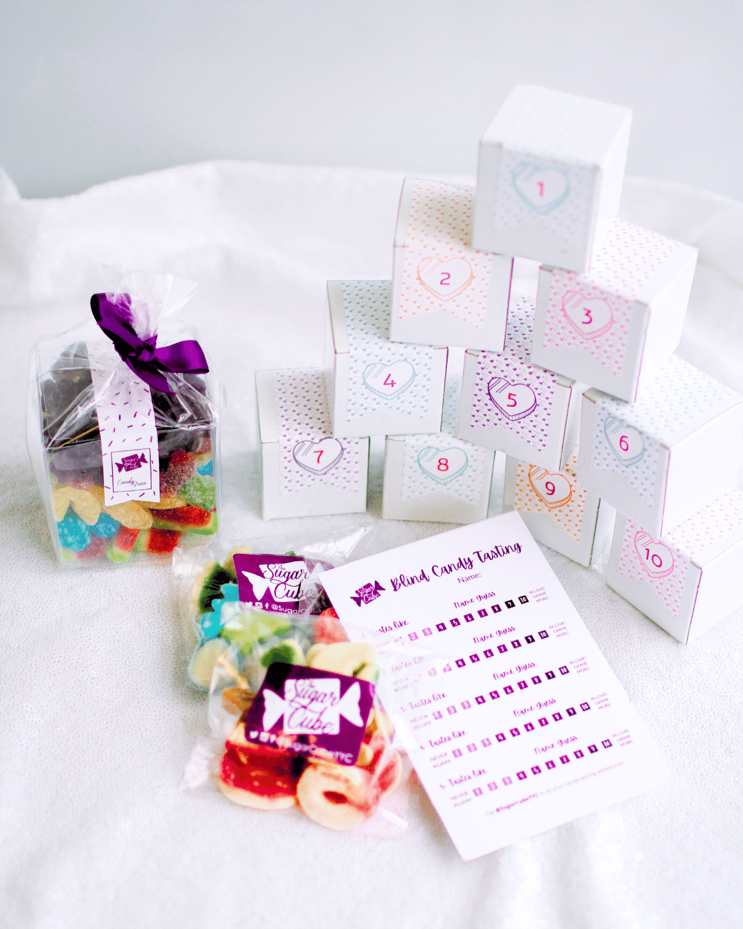 Take-home Blind Candy Tasting Package with numbered mystery candy boxes, scorecard and take-home candy bags