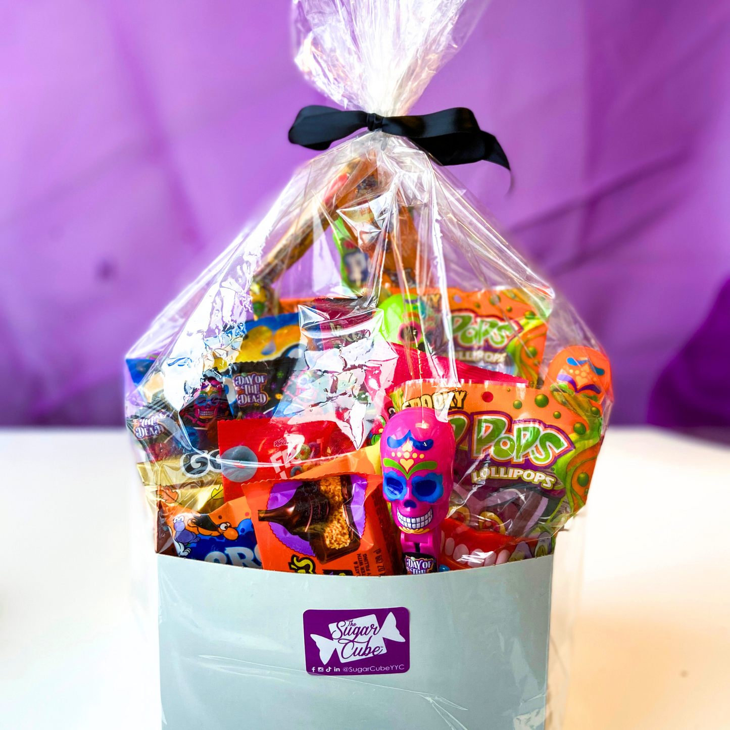 Wrapped Halloween candy basket packed with assorted treats from The Sugar Cube